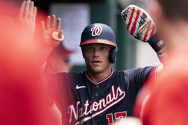 Washington Nationals shortstop CJ Abrams yawns behind his glove