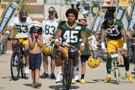 Green Bay Packers' Josh Myers rides a bike to NFL football training camp  Thursday, July 27, 2023, in Green Bay, Wis. (AP Photo/Morry Gash Stock  Photo - Alamy