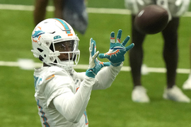 Miami Dolphins guard Austin Jackson (73) and center Alama Uluave