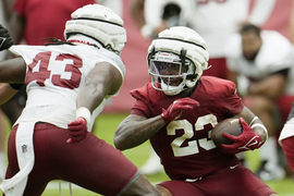 Arizona Cardinals wide receiver Rondale Moore, right, runs with the ball as  Cardinals safety Jalen Thompson, left, closes in during NFL football  training camp practice at State Farm Stadium Saturday, July 29