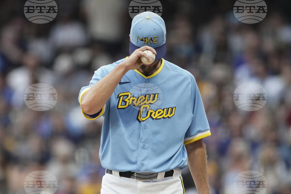 Milwaukee Brewers' Andruw Monasterio (14) fields a ground ball out off the  bat of Pittsburgh Pirates' Andrew McCutchen during the fourth inning of a  baseball game Saturday, Aug 5, 2023, in Milwaukee.