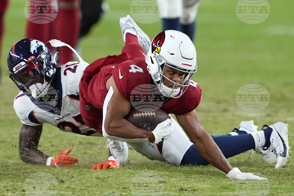 Denver Broncos defensive tackle Elijah Garcia celebrates after a sack  against the Arizona Cardinals during the second half of an NFL preseason  football game in Glendale, Ariz., Friday, Aug. 11, 2023. (AP