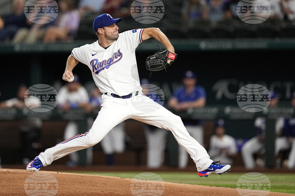 Dallas Mavericks draft pick Dereck Lively II, throws out the ceremonial  first pitch before a baseball game between the Los Angeles Angels and Texas  Rangers, Monday, Aug. 14, 2023, in Arlington, Texas. (