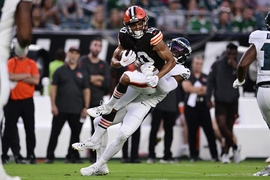 Cleveland Browns safety Ronnie Hickman Jr. intercepts a pass in front of Philadelphia  Eagles tight end Grant Calcaterra (81) during the first half of an NFL  preseason football game Thursday, Aug. 17