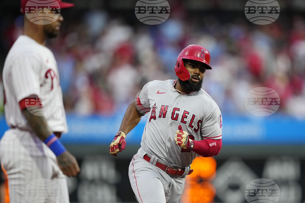 Philadelphia Phillies' Trea Turner follows through after hitting a home run  against Los Angeles Angels pitcher Jaime Barria during the eighth inning of  a baseball game, Tuesday, Aug. 29, 2023, in Philadelphia. (