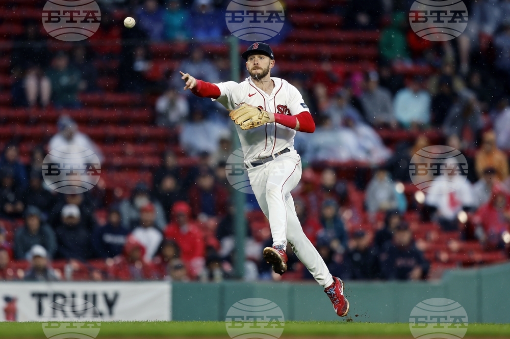 Boston Red Sox's Adam Duvall watches the flight of his home run in the  sixth inning of a baseball game against the Chicago White Sox, Sunday,  Sept. 24, 2023, in Boston. (AP