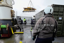 The Bulgarian naval research vessel Sv. Sv. Kiril i Metodii (RSV 421) crew and the logistics team at the Bulgarian Antarctic base clean the shore