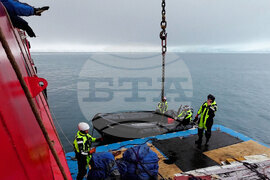 The Bulgarian naval research vessel Sv. Sv. Kiril i Metodii (RSV 421) crew and the logistics team at the Bulgarian Antarctic base clean the shore