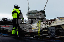 The Bulgarian naval research vessel Sv. Sv. Kiril i Metodii (RSV 421) crew and the logistics team at the Bulgarian Antarctic base clean the shore